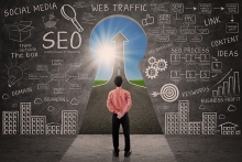 Businessman looking through key hole with SEO doodle on 